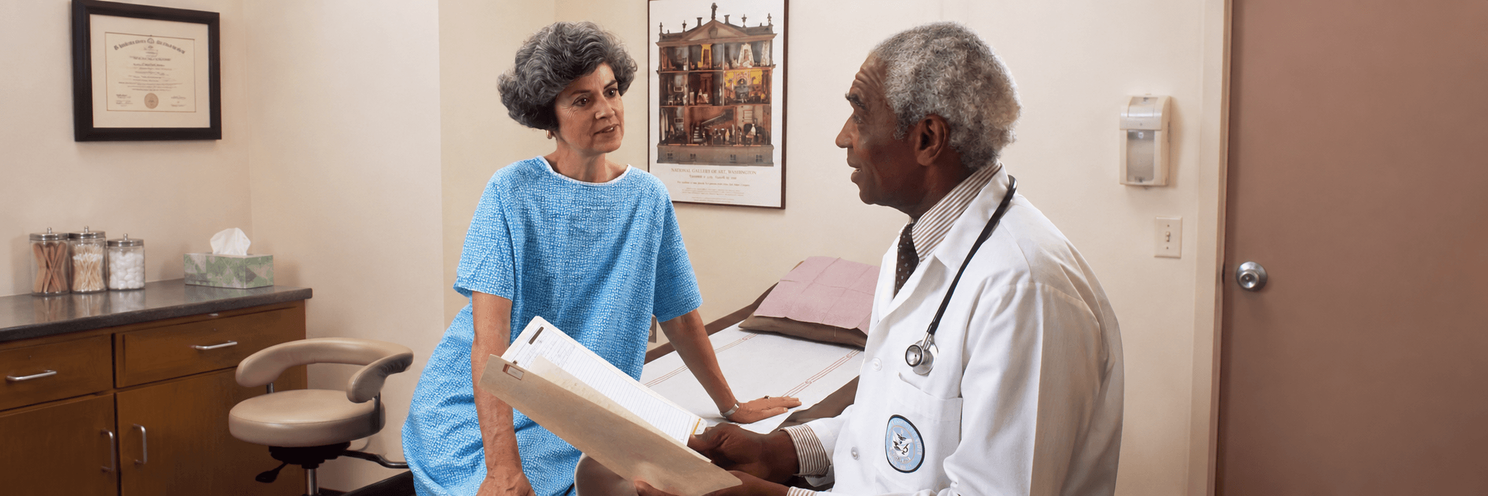 Doctor discussing medical coverage with a patient